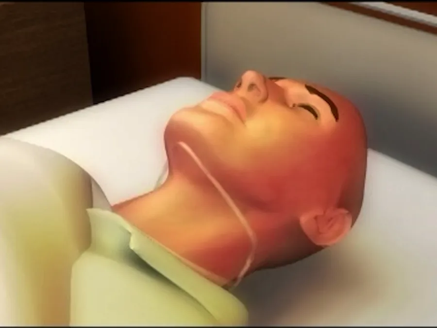 Szene aus dem Anwendungsfilm, Schritt 3: der größere Bereich der Kinnstütze liegt Richtung Brust und Schlüsselbein (Animation)